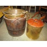 A large brass shell case timber and iron bound bucket and two brass buckets