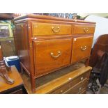 A Chinese hardwood chest enclosing two deep and two shallow drawers, the deep drawer with