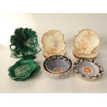 A collection of early 20th century Limoges dessert wares of shaped form with painted floral sprays