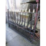 A pair of good quality heavy gauge iron driveway entrance gates with spear head finials and