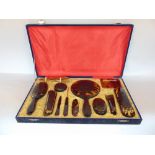 Early 20th century cased Japanese tortoiseshell dressing set, the base hinged case fitted with