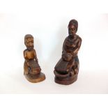 Two similar tribal carved wooden figures of musicians, one inscribed Arteiin to base, the other