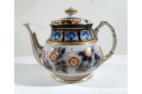 MACINTYRE, BURSLEM TEAPOT OF MOULDED CIRCULAR FORM, WITH RED, BLUE AND