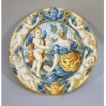 LATE C18th ITALIAN MAIOLICA CIRCULAR PLATE PAINTED WITH A CLASSICAL WOMAN AND CHERUB IN A COUNTRY