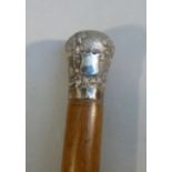 BURMESE SILVER TOPPED HARDWOOD CANE, THE SILVER TOP DEPICTING A RURAL VILLAGE SCENE WITH AN OX AND