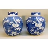 NEAR PAIR OF CHINESE LIDDED BLUE AND WHITE 'GINGER' JARS (23 cm x 24 cm)