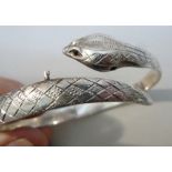 SILVER HINGED SERPENT BRACELET, SILVER ENGRAVED HINGED BRACELET AND AN ABALONE SET WHITE METAL