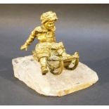 LATE C19th BRONZE FIGURE OF A YOUNG MAN IN WINTER CLOTHING ASTRIDE A TOBOGGAN, CAST IN FINE