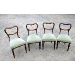 TWO PAIRS OF VICTORIAN ROSEWOOD DINING CHAIRS, EACH WITH AN OPEN BACK AND UPHOLSTERED SEAT, ON