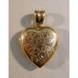 9ct GOLD HEART LOCKET PENDANT (4.4g) AND A 9ct GOLD MUG CHARM (2g)