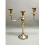 SILVER THREE LIGHT CANDELABRUM WITH TWO REEDED SCROLL BRANCHES, ON A TAPERING CYLINDRICAL COLUMN,