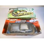 A JOYRIDE 007 JAMES BOND GOLDFINGER 1965 ASTON MARTIN DB5 MODEL, BOXED AND A POLISTIL RC 201 RADIO