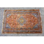 PERSIAN MADDER & INDIGO FIELD RUG WITH A CENTRAL LOZENGE MEDALLION, SPANDRELS L.149cm W. 98cm