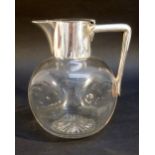VICTORIAN GLASS AND SILVER MOUNTED DIMPLE WHISKY JUG FROM A DESIGN BY CHRISTOPHER DRESSER, WITH FLAT