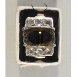 WHITE METAL RING SET FIVE DIAMONDS @ 1/8th CT APPROXIMATELY AND A WHITE STONE, CENTRE STONE MISSING