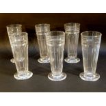 A SET OF SIX EDWARDIAN STUART TAPERING CYLINDRICAL TUMBLERS WITH CUT FLOWERS BENEATH REEDED BANDS,