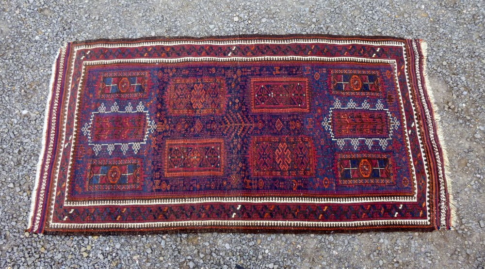 EASTERN INDIGO FIELD RUG WITH ALL OVER FLORAL PANELLED DECORATION AND OTHER MOTIFS, L.194cm W. 106cm