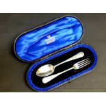 GEORGE V CHRISTENING SET COMPRISING SPOON AND FORK, BRIGHT CUT WITH ENGRAVED INITIALS, RETAILED BY