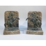 PAIR OF ITALIAN ALABASTER BOOKENDS EACH MOUNTED WITH A BRONZED SPELTER MARLEY HORSE WITH FIGURE (