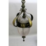 AN ARTS AND CRAFTS HANGING BRASS AND CUT GLASS LANTERN PARTIALLY ACID ETCHED WITH A