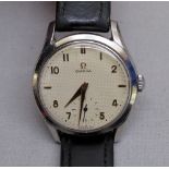 A 1950's OMEGA GENTLEMAN'S STAINLESS STEEL MANUAL WIND WRISTWATCH WITH SECONDS DIAL