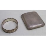 A SILVER CIGARETTE CASE, SILVER INGOT PENDANT ON A CHAIN, A SILVER HINGED BANGLE/BRACELET WITH