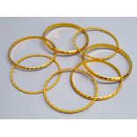 SEVEN 22ct GOLD BANGLES (73.1g)