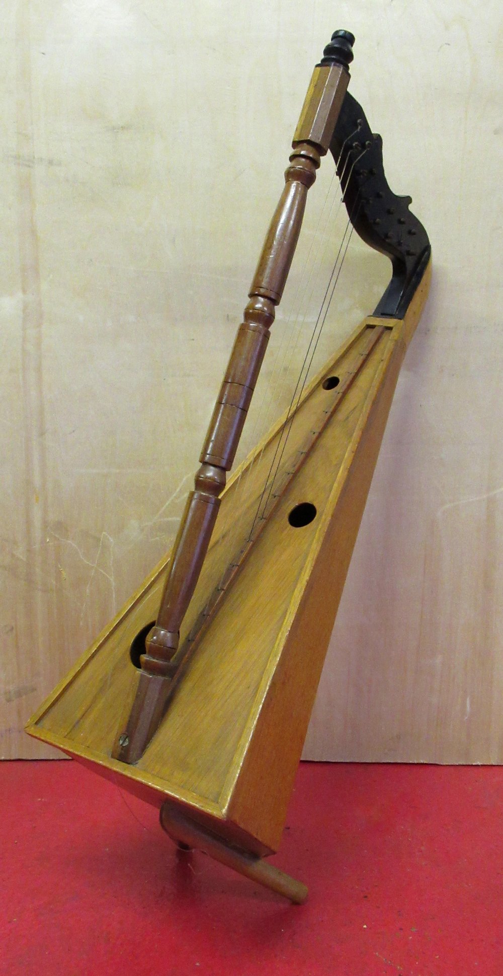 A VENEZUELAIN HARP, NINE STRINGS MISSING (OVERALL LENGTH: 72.5cm)