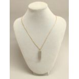 A 9CT GOLD PENDANT SET DIAMOND (1/16th ct) AND QUARTZ ON A 9ct GOLD FINE SNAKE CHAIN NECKLACE,