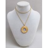 A 9ct GOLD HALF SOVEREIGN HOLDER ON A 9ct GOLD PRINCE OF WALES CHAIN, LENGTH 61 cm (14.9g) [2]