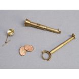 TWO 9ct GOLD CIGAR PIERCERS, A SINGLE 9ct GOLD CUFFLINK AND A 9ct GOLD TIE TACK (GROSS WEIGHT 20.9g)