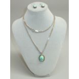 A JADEITE OVAL SHAPED PENDANT AND A PAIR OF SIMILAR DROP EARRINGS SET IN SILVER STAMPED 925 TOGETHER