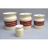 AN UNUSUAL SET OF THREE T.G. GREEN & CO. LTD RUBY RED AND BLACK BANDED STORAGE JARS (TALLEST: 18.