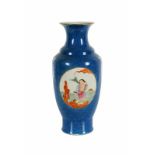 A porcelain powder blue baluster vase with a polychrome decor of two medallions depicting a