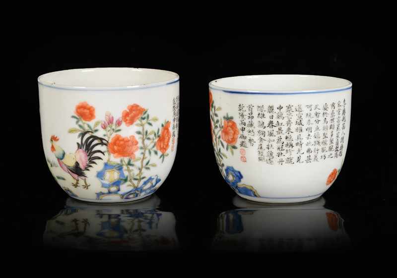 A pair of polychrome porcelain chicken cups with a decor of a man, flowers and a poem of Emperor