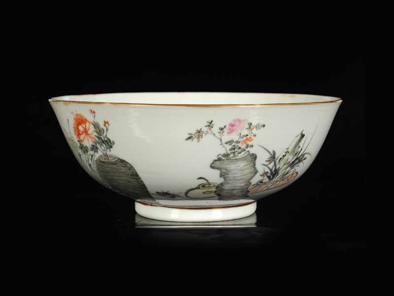 A polychrome porcelain bowl with a decor of flower pots and characters. Marked with four-character