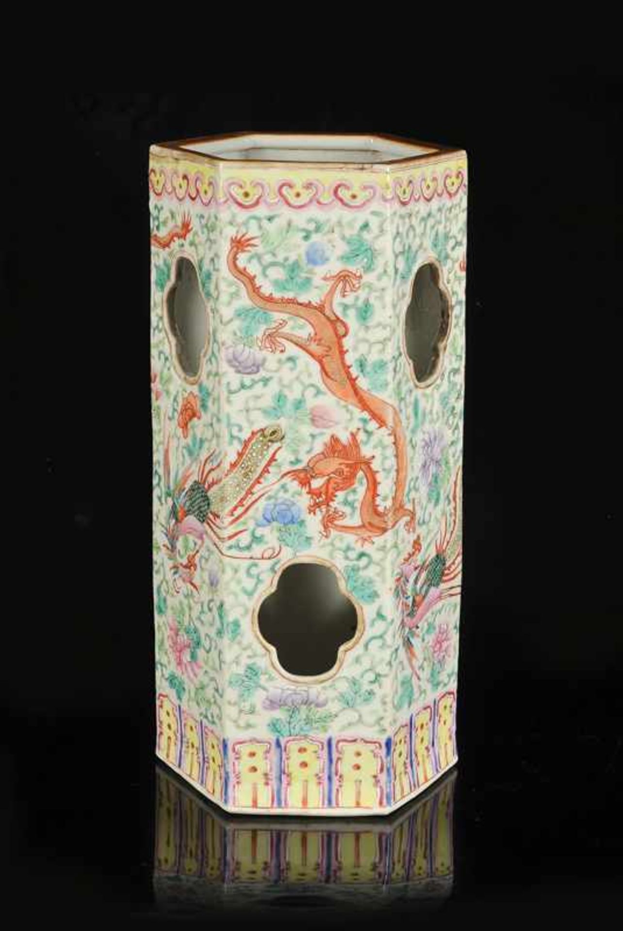 A polychrome porcelain hatstand with a decor of dragons and a phoenix. Marked with seal mark