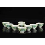 Nine polychrome porcelain cups with a paksoi decor. Marked with seal mark Qianlong. China, 20th