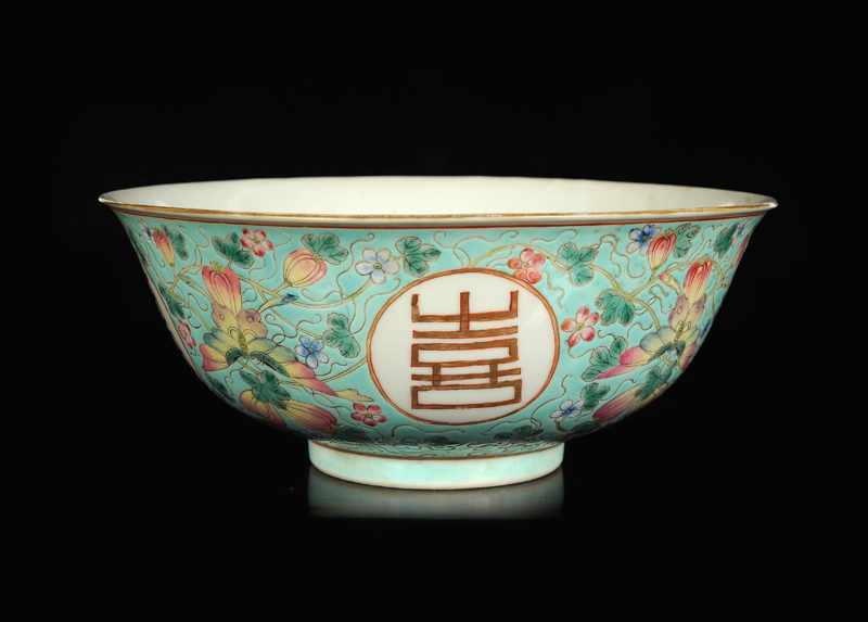 A polychrome porcelain bowl with decor of four medallions with the characters Fu, Lu, Shou, Xi.