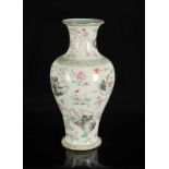 A polychrome porcelain baluster vase with a decor of medallions with flowers, birds, river landscape