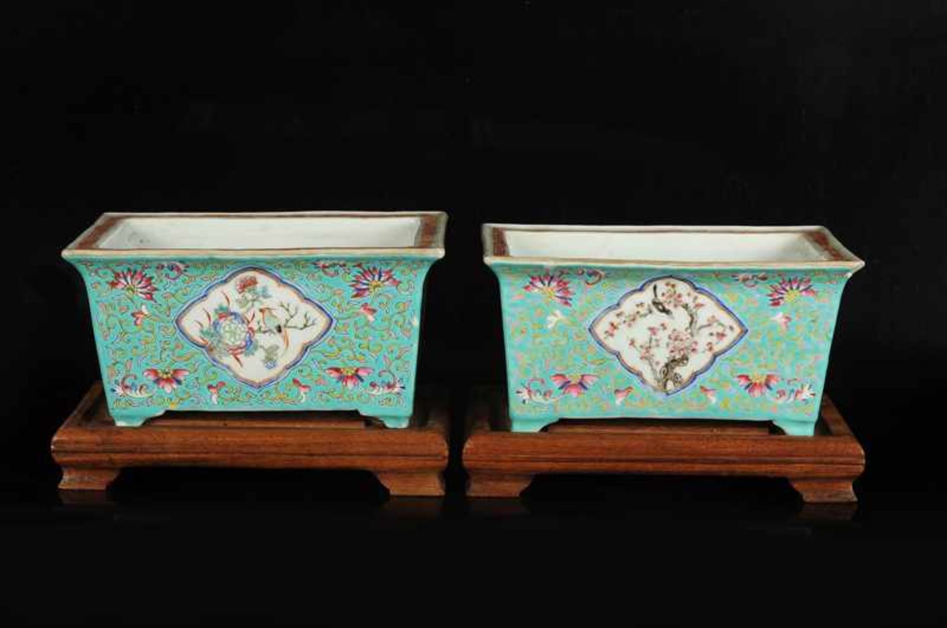 A pair of green glazed porcelain jardinières with a polychrome decor of birds and flower branches. - Image 4 of 5