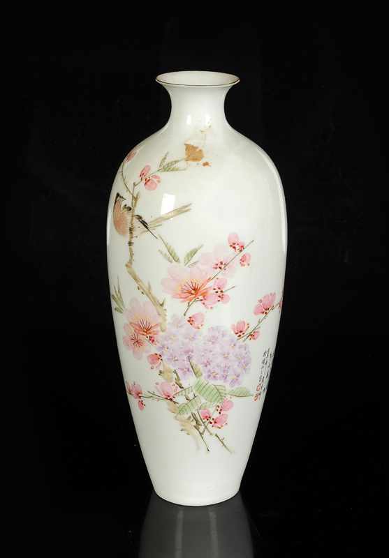 An eggshell porcelain vase with a decor of flower branches and a bird. Marked with seal mark