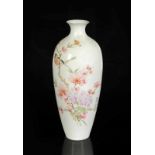 An eggshell porcelain vase with a decor of flower branches and a bird. Marked with seal mark