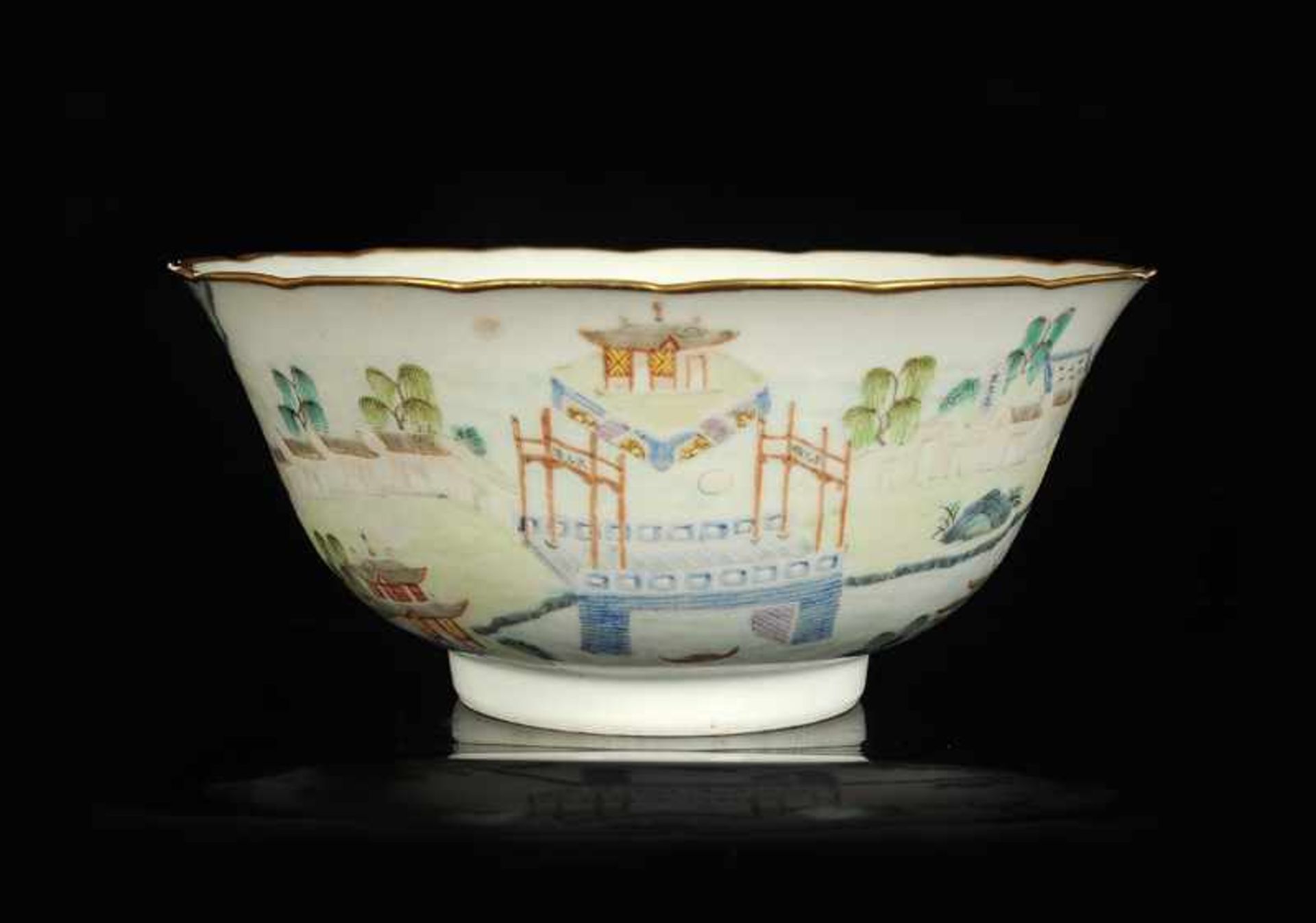 A polychrome porcelain bowl with a decor of a river landscape with a bridge and a poem of Wu