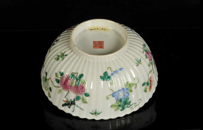 A polychrome porcelain ribbed bowl with scalloped rim and a decor of flowers and insects. Marked - Image 3 of 4