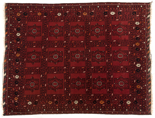 AN AFGHAN RUG, MODERN the red field divided into squares each with gul depicted in black and ivory