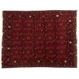 AN AFGHAN RUG, MODERN the red field divided into squares each with gul depicted in black and ivory