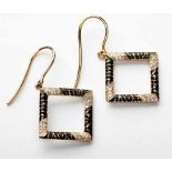 A PAIR OF DIAMOND AND ENAMEL PENDANT EARRINGS each in the form of an openwork square-shaped frame,