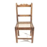 A CAPE STINKWOOD SIDE CHAIR the scrolled top rail above a reeded mid-rail between reeded supports,