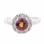 A MANDARIN GARNET RING centred with a mixed-cut mandarin garnet weighing approximately 2.08cts,